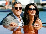 George Clooney, left, and Amal Alamuddin arrive in Venice, Italy, Friday, Sept. 26, 2014. Clooney, 53, and Alamuddin, 36, are expected to get married this weekend in Venice, one of the world s most romantic settings. (AP Photo/Luca Bruno)