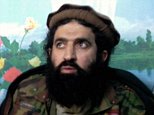 Tehreek-e-Taliban Pakistan (TTP) spokesman Shahidullah Shahid (R) speaks during a press conference at an undisclosed location in Pakistan on February 21, 2014. Pakistani jets launched strikes on Taliban hideouts in the northwest, killing at least 30 people, according to security sources, in retaliation for attacks by the militants which have derailed peace talks. AFP PHOTO/NASEER AZAM