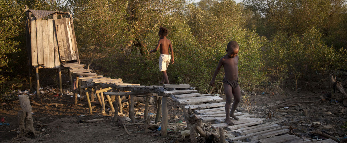 Children using an unclean sanitation block, Madagascar.